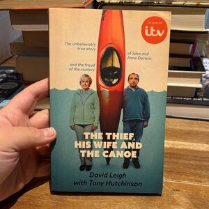 The Thief, His Wife and The Canoe — Paperback Book (Blue/Orange)
